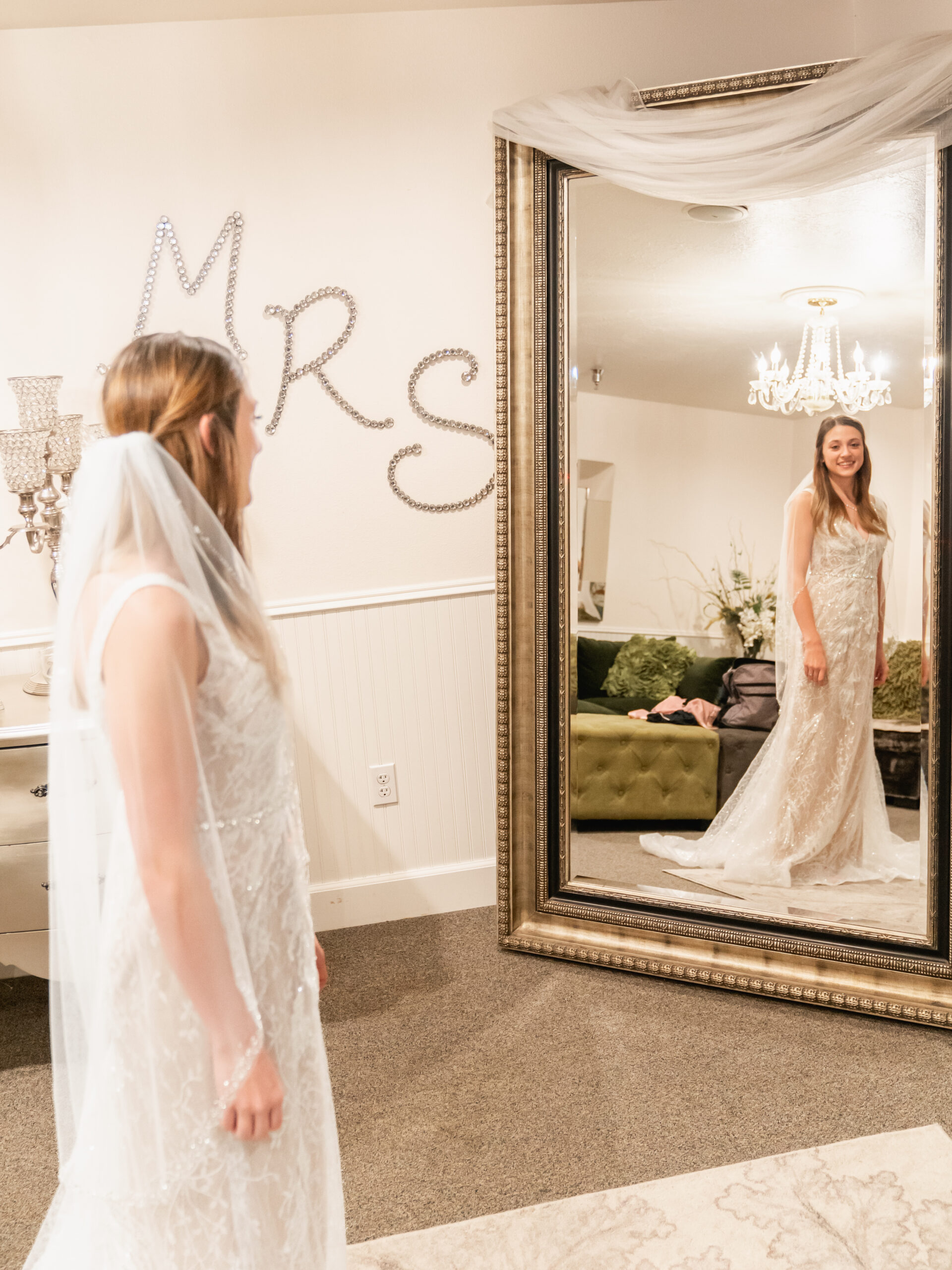 bride in wedding dress in front of the mirror - photo by 4Karma Studio