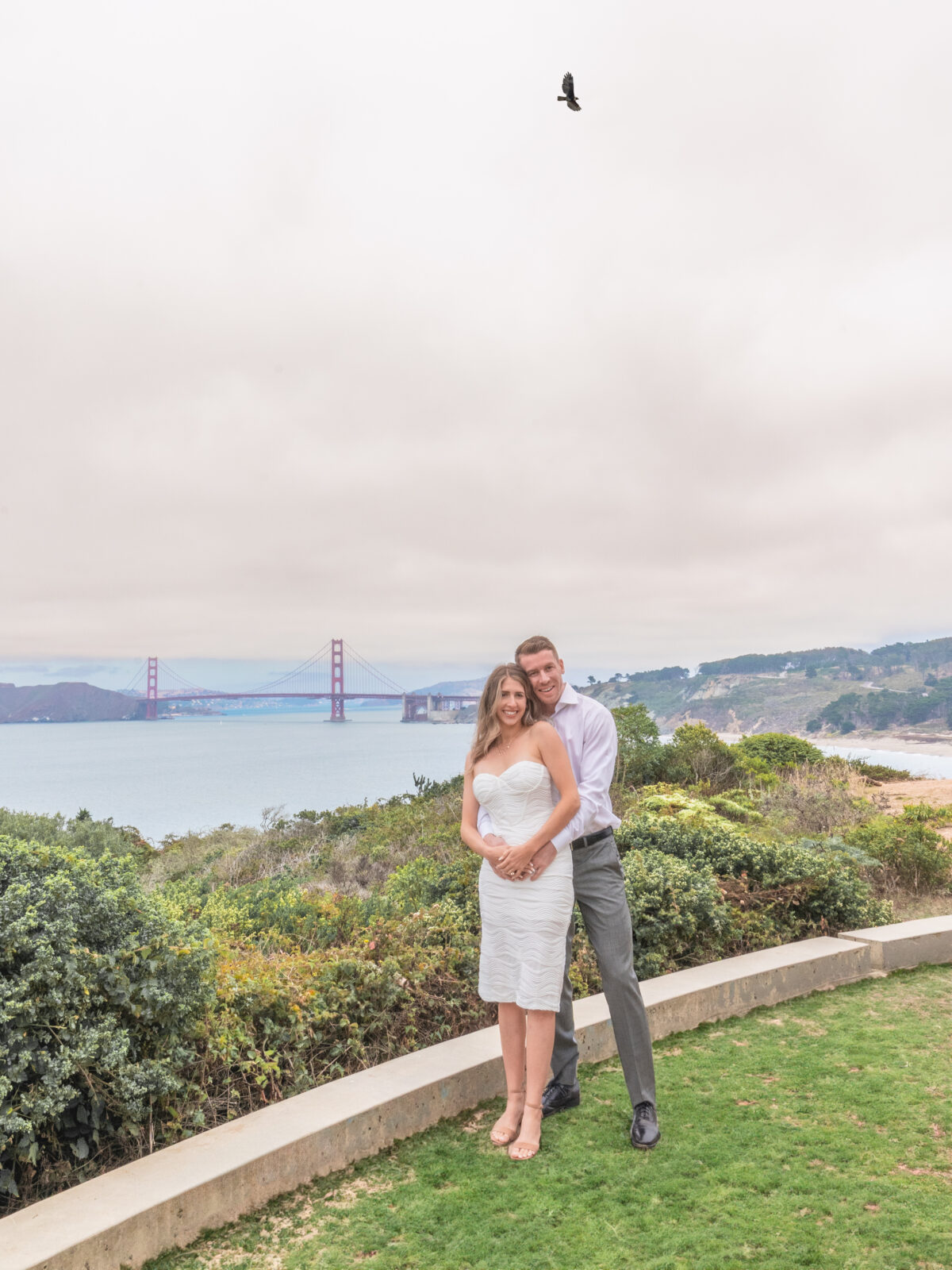 Couple Portrait with Golden Gate Bridge and bird for Engagement Photo Session in San Francisco 