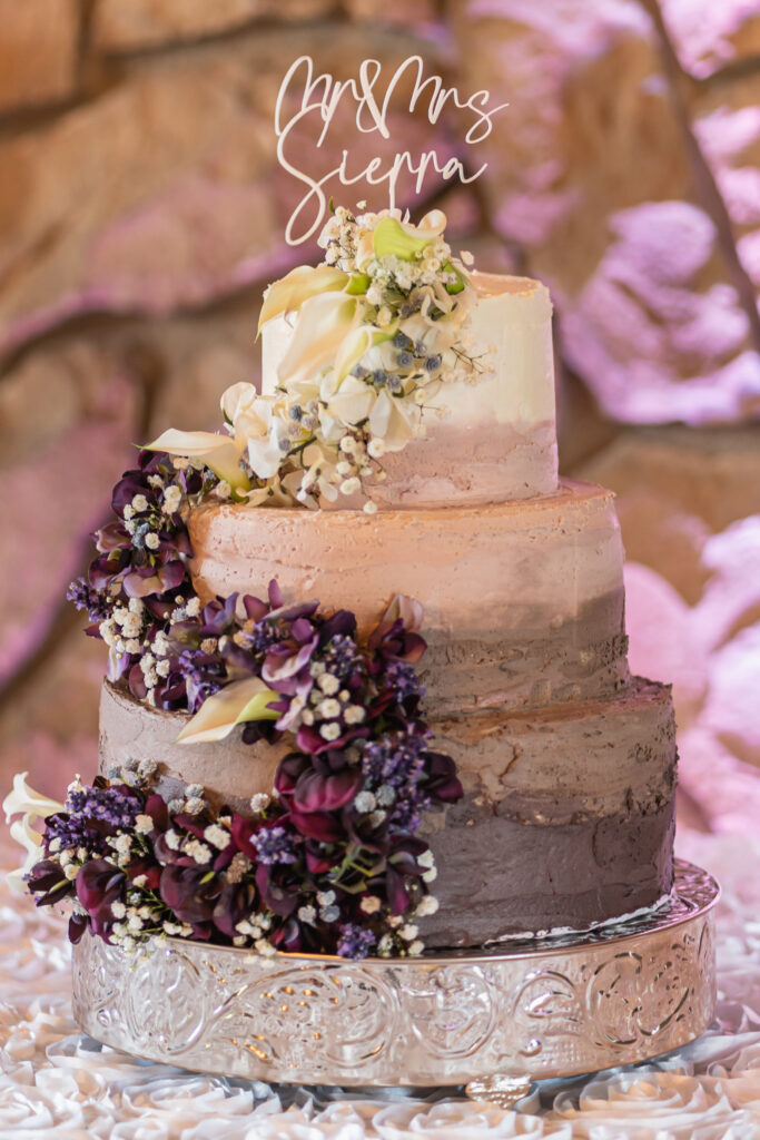 artistic wedding cake with coffee, chocolate and vanilla, decorated with real flowers